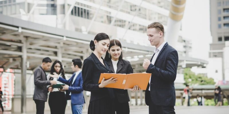 business-coworkers-discussing-new-ideas-brainstorming-together-looking-new-project-document_1150-3066