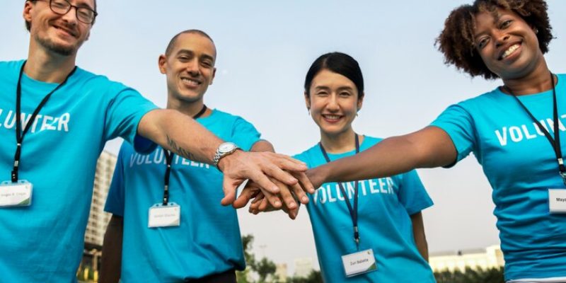 team-volunteers-stacking-hands_53876-20900
